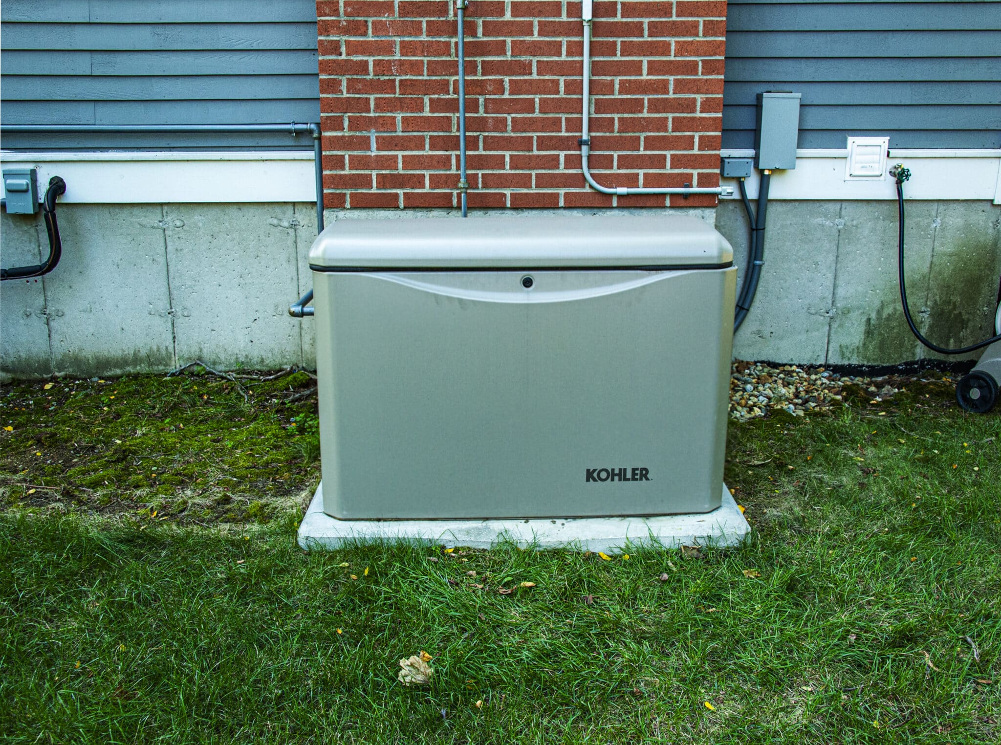 Whole-House Generators on concrete pad.